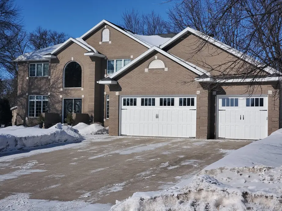 A completed garage door installation by Quality Garage Door in West Fargo, winter